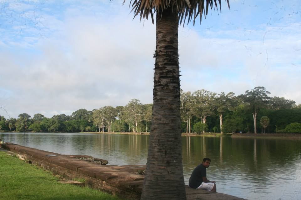 the drizzle of the morning has faded..the wetness of early dawn is slowing being replaced by a searing heated blue sky....resting at the extremely well-maintained water bodies around Angkor Wat.