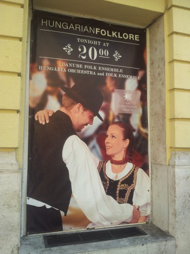 an ad for the Hungarian folk show in front of the theater